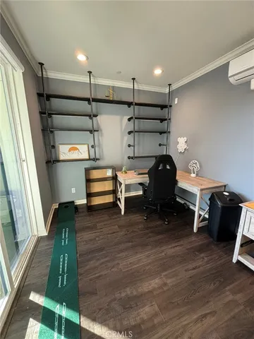 a view of hallway with wooden floor and furniture