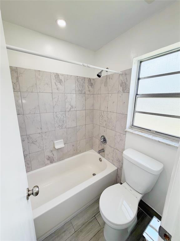 2710 Riverside Drive, Unit 201 Coral Springs, FL 33065 - Photo 23 of 37 a bathroom with a toilet and a bathtub