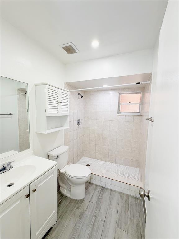 2710 Riverside Drive, Unit 201 Coral Springs, FL 33065 - Photo 29 of 37 a bathroom with a sink a toilet and shower