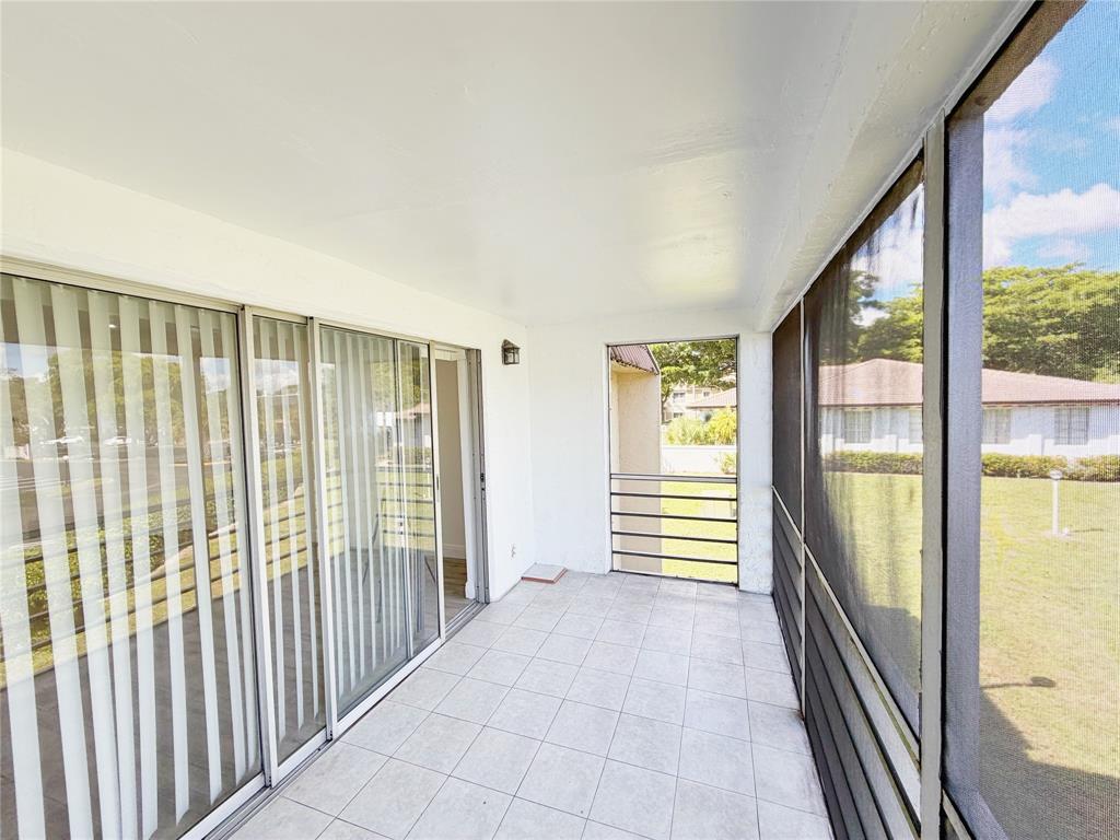 2710 Riverside Drive, Unit 201 Coral Springs, FL 33065 - Photo 32 of 37 a view of a room with windows