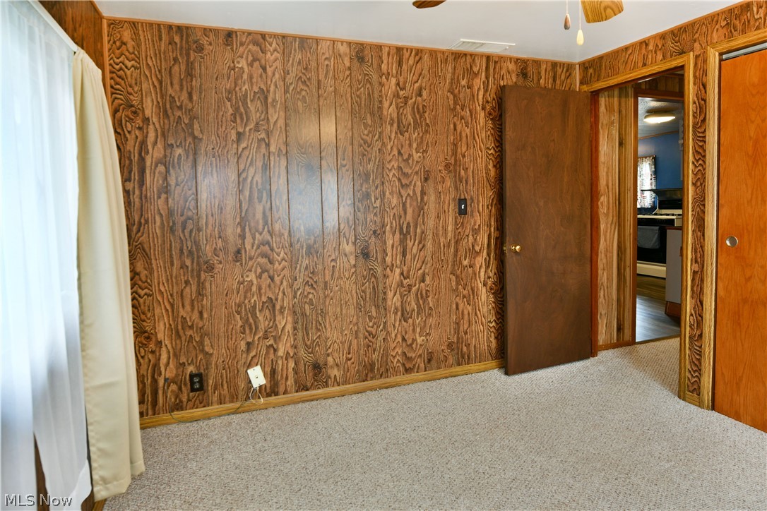 878 Ridge Road Vienna, OH 44473 - Photo 47 of 50 Spare room with carpet and ceiling fan