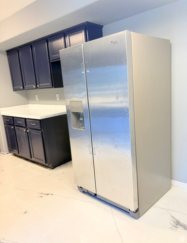 8116 North Ridge Loop West, Unit 8 Eagle Mountain, UT 84005 - Photo 7 of 23 Kitchen with stainless steel fridge with ice dispenser and light countertops