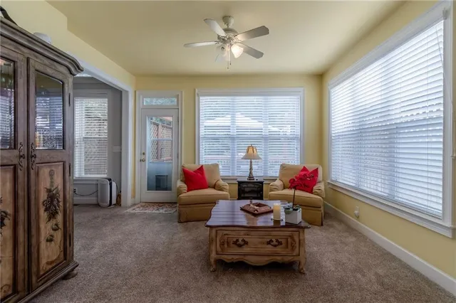 a living room with furniture and a window
