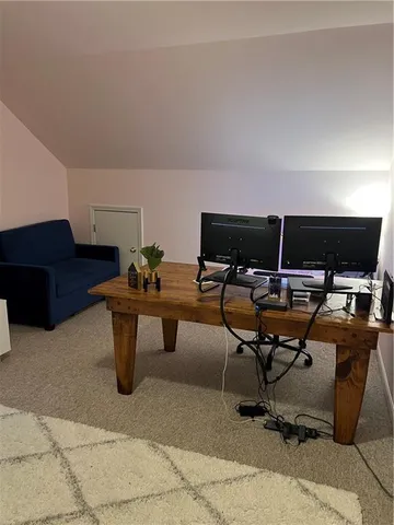 a view of workspace with livingroom view