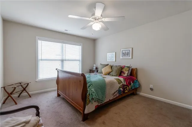 a bed room with a bed and a window