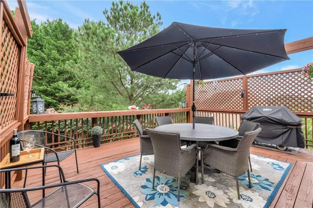 a view of balcony with furniture and umbrella
