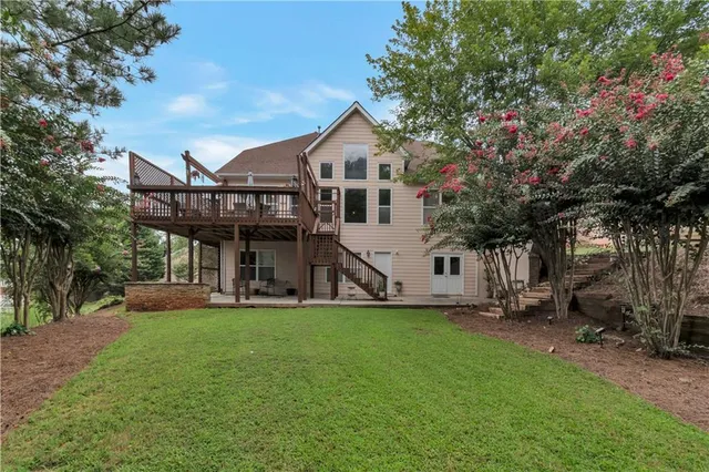 a front view of a house with a yard and porch
