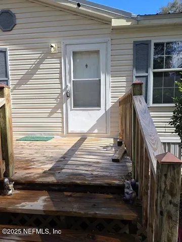 a view of backyard with deck