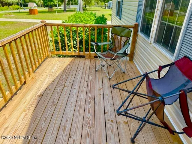 a view of balcony with furniture