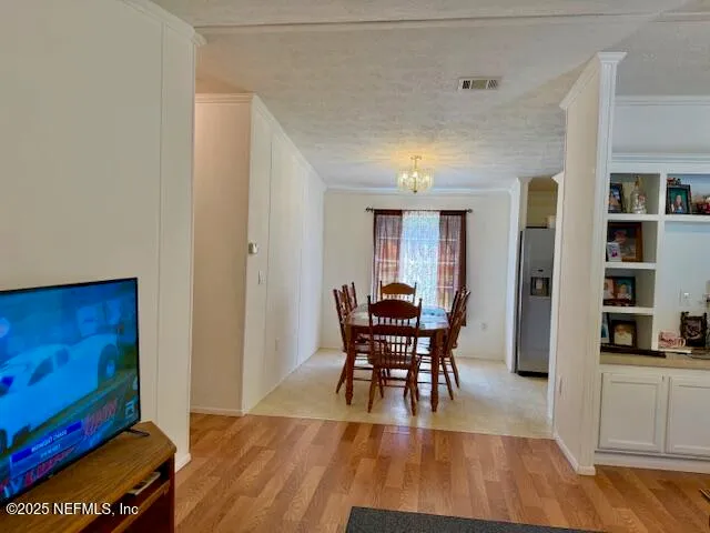 a bedroom with furniture and a lamp