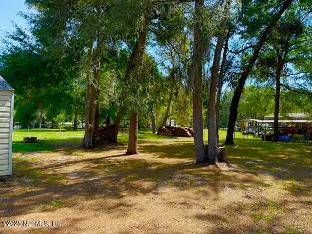 a view of a yard with a house