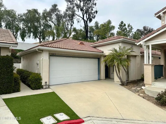 a view of a house with a garage