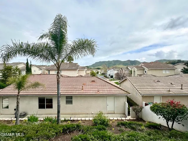 a view of a swimming pool with a lounge chair