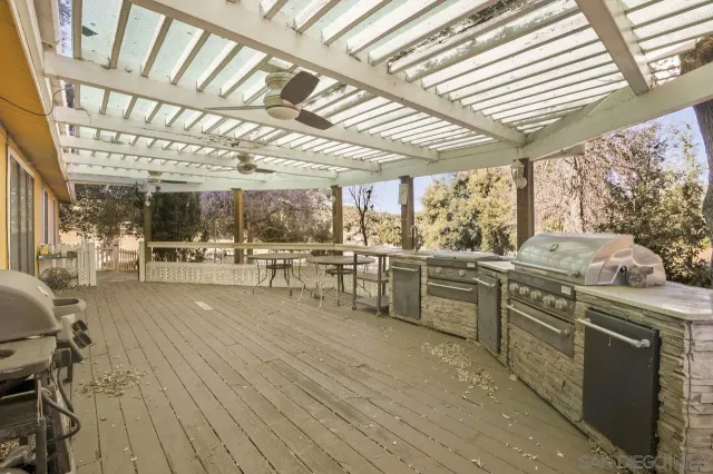 a kitchen with stainless steel appliances and white cabinets