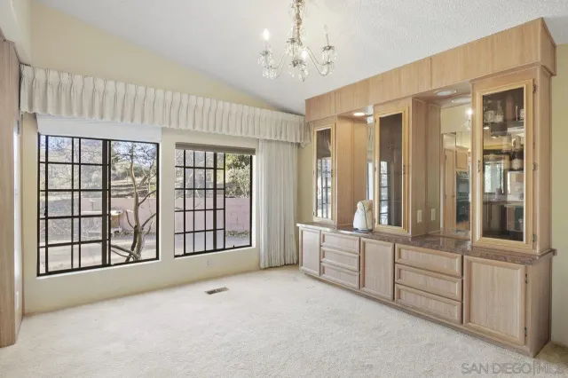 a view of an empty room with windows