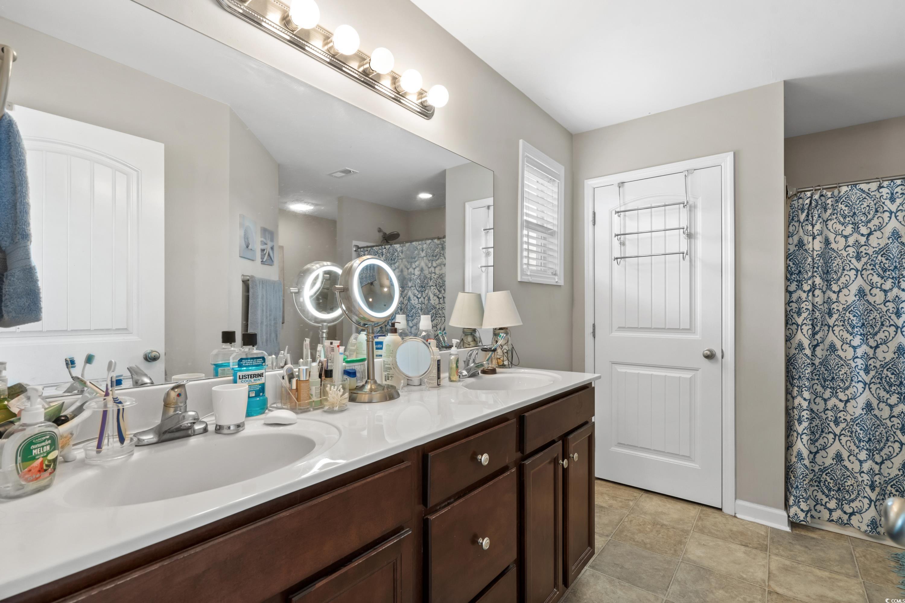 210 Georgia Mae Loop Conway, SC 29527 - Photo 22 of 40 Bathroom featuring double vanity, a shower with sh