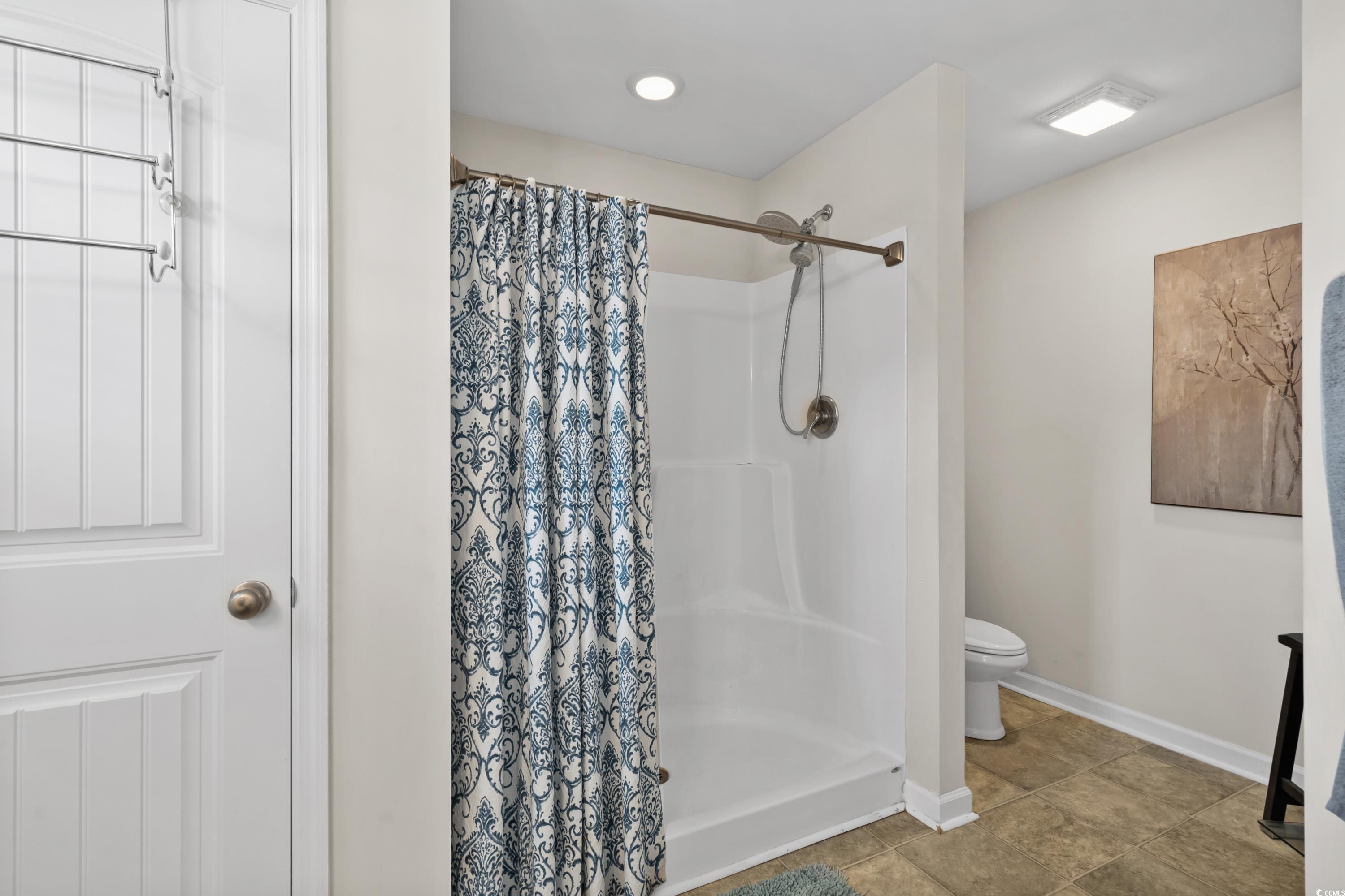 210 Georgia Mae Loop Conway, SC 29527 - Photo 23 of 40 Bathroom with baseboards, toilet, tile patterned f