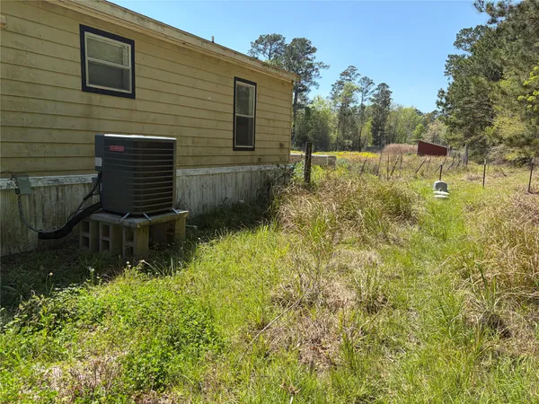 a view of a back yard of the house