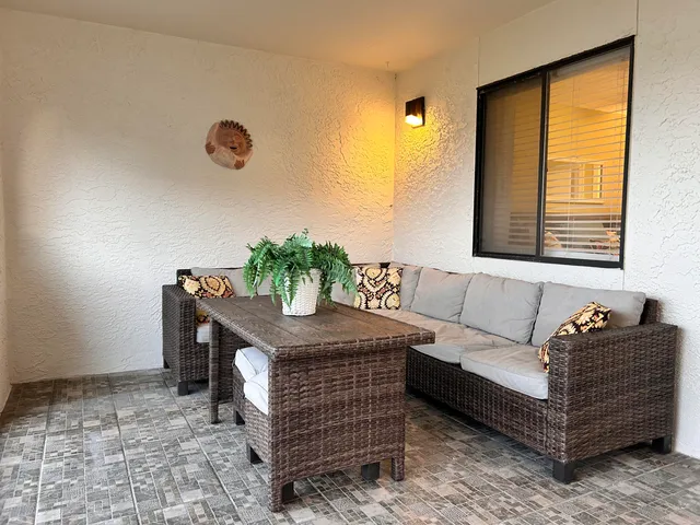 a living room with furniture and a window