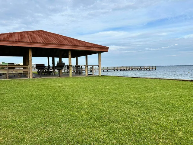 a view of an chairs and table in patio