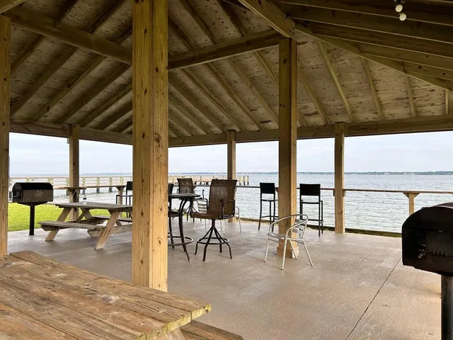 a view of a swimming pool and an outdoor seating
