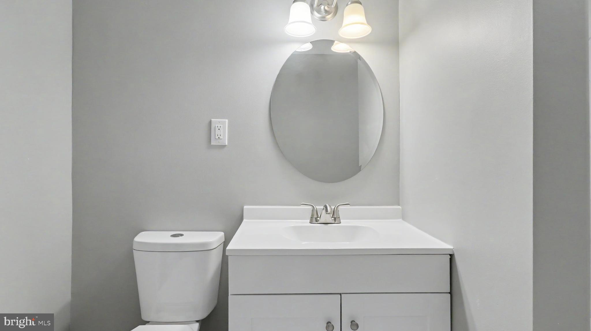 4203 Shell Street Capitol Heights, MD 20743 - Photo 3 of 47 a bathroom with a sink a toilet and a mirror