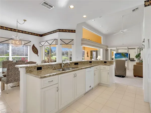 a kitchen with a sink and a refrigerator