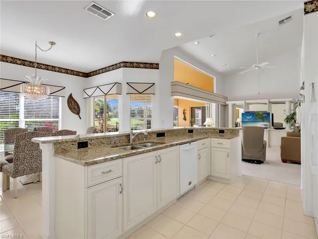 a kitchen with a sink and a refrigerator