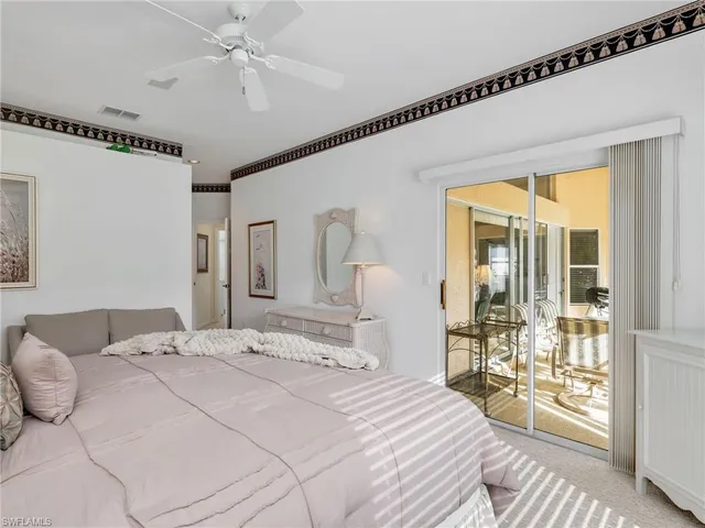 a bathroom with a granite countertop tub shower and sink