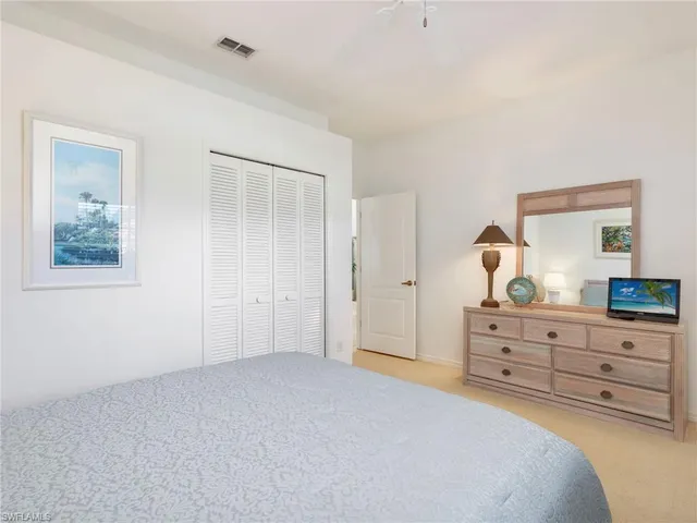 a bedroom with two beds and a window