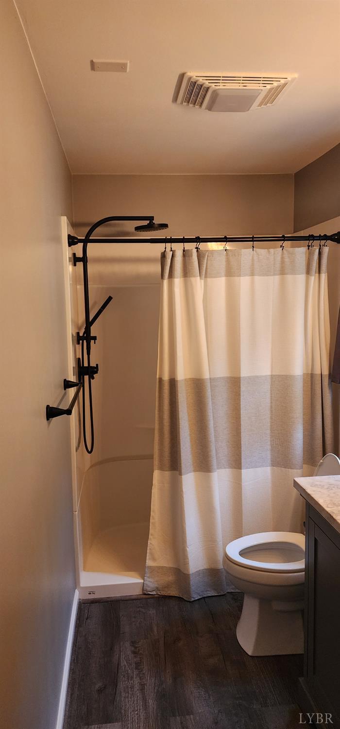 297 Poor House Farm Road Amherst, VA 24521 - Photo 27 of 52 a bathroom with a toilet and a shower