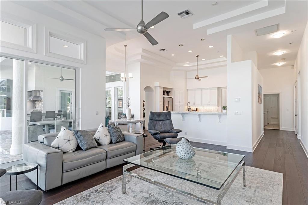 2540 Half Moon Walk Naples, FL 34102 - Photo 18 of 44 a living room with furniture and a rug