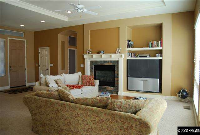 625 Rabbit Ridge Court Reno, NV 89511 - Photo 3 of 9 a living room with furniture and a fireplace