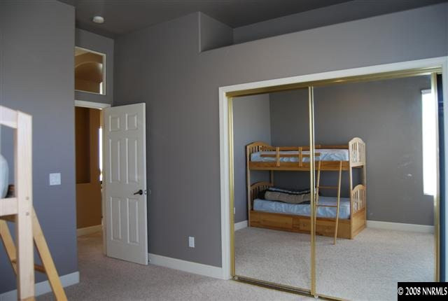 625 Rabbit Ridge Court Reno, NV 89511 - Photo 5 of 9 a bedroom with bed and a large window