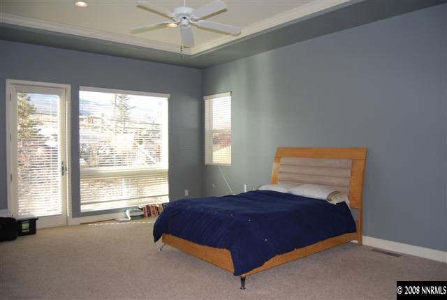 625 Rabbit Ridge Court Reno, NV 89511 - Photo 8 of 9 a bedroom with a large bed and a window
