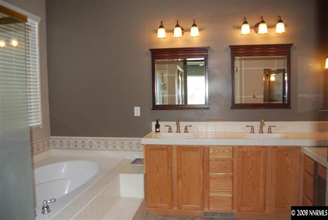625 Rabbit Ridge Court Reno, NV 89511 - Photo 9 of 9 a bathroom with a sink and a mirror