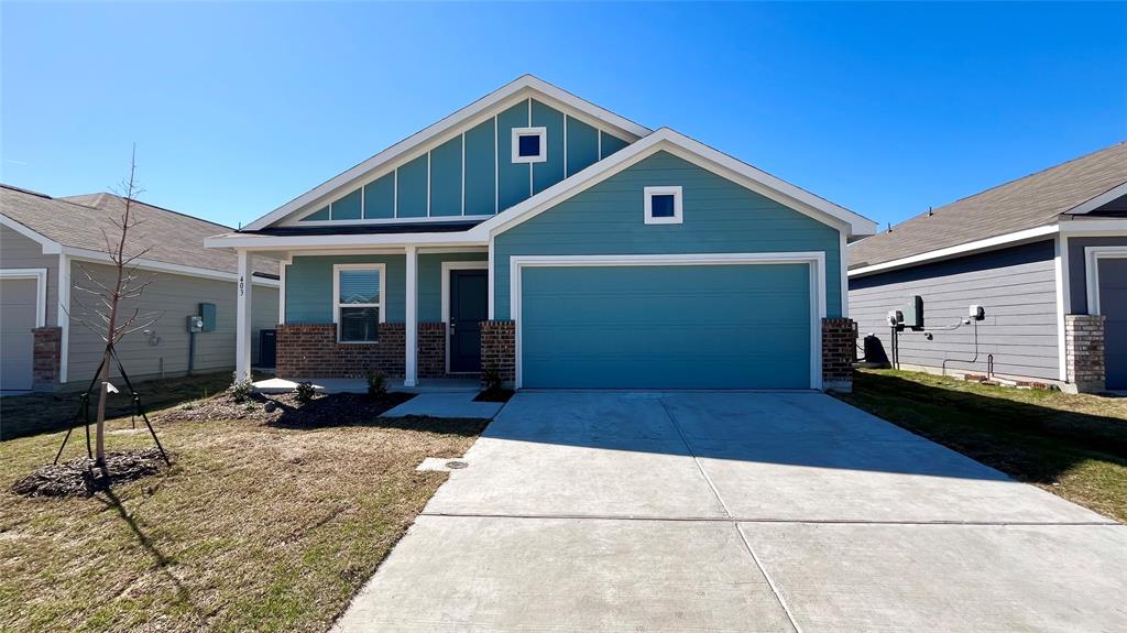 403 Ashbrook Way Princeton, TX 75407 - Photo 1 of 23 Contemporary exterior featuring teal siding, white trim, and a covered front porch
