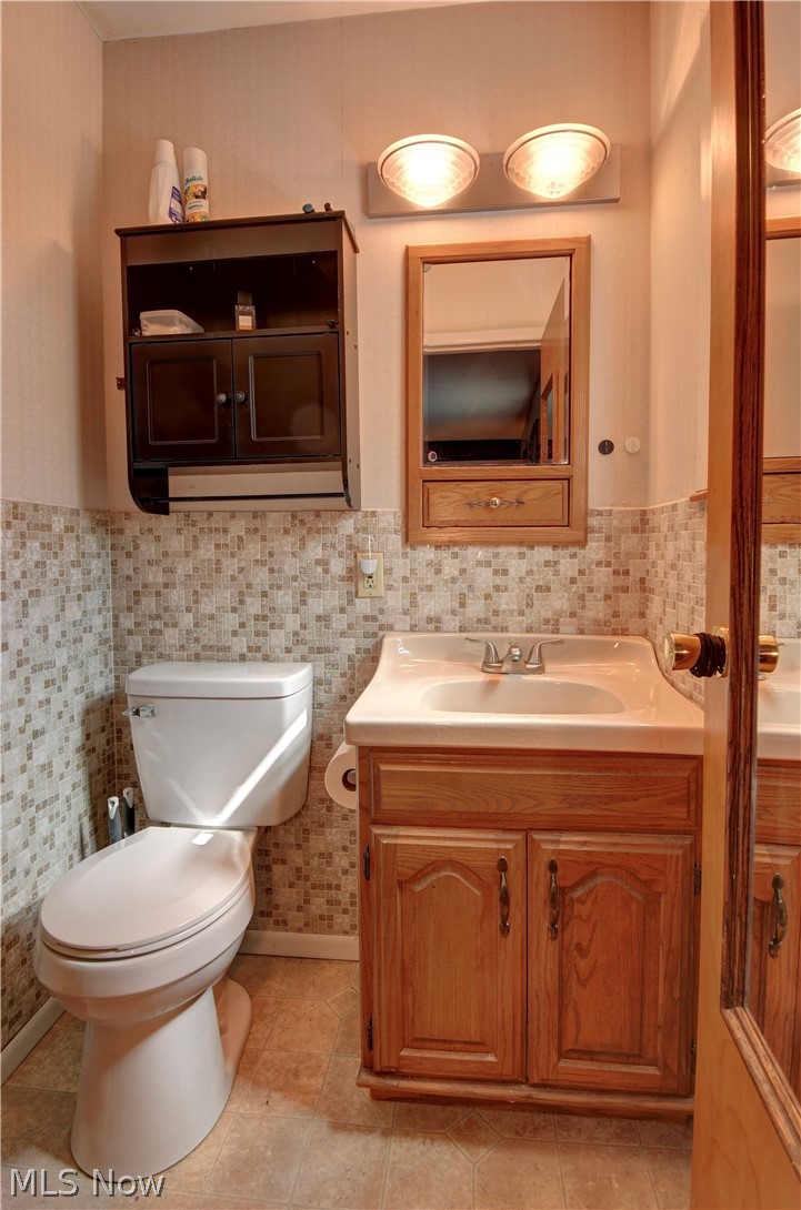 3963 Ranfield Road Kent, OH 44240 - Photo 15 of 23 Bathroom featuring backsplash, and vanity