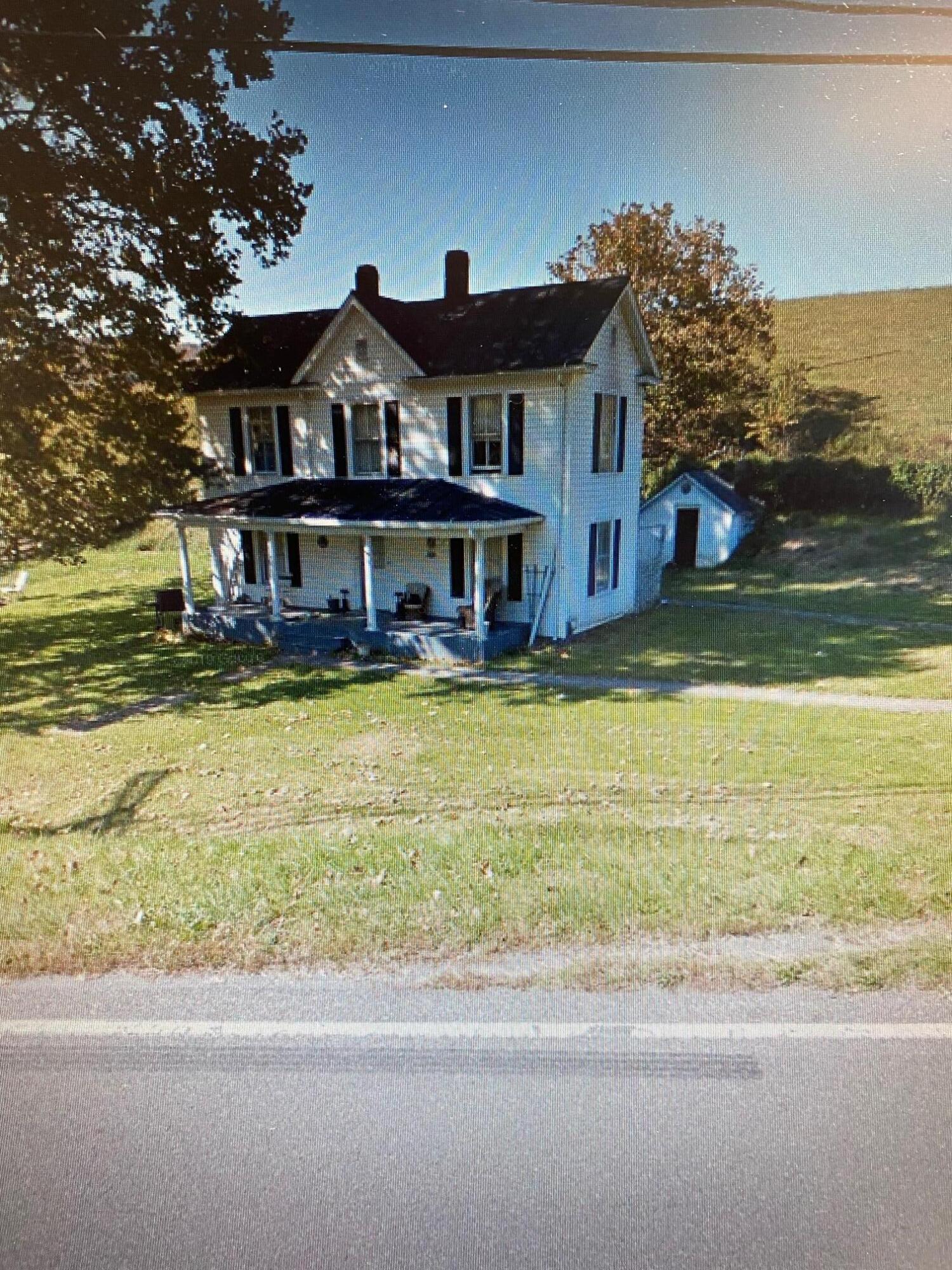 front view of a house with a trees