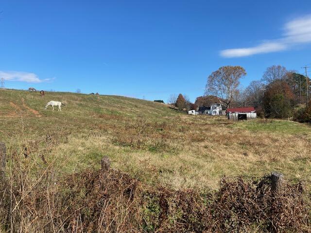 4569 Jordantown Road Vinton, VA 24179 - Photo 2 of 10 a view of a big yard with a house in the background