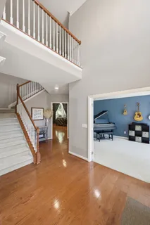 a view of a livingroom with furniture and staircase