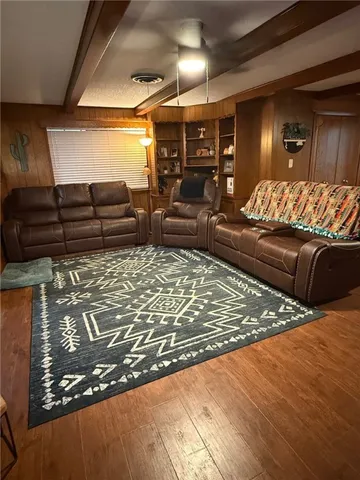 a living room with lots of furniture and a rug
