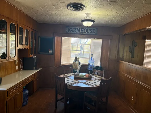a view of a dining room with furniture and window