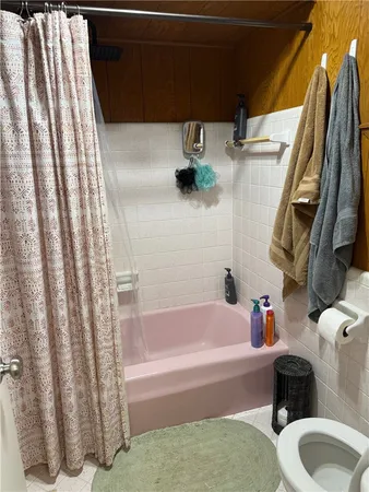 a bathroom with a sink toilet and bathtub