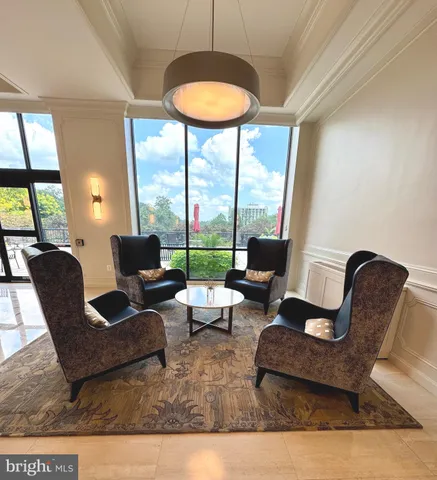 a kitchen with granite countertop a stove a sink and a microwave