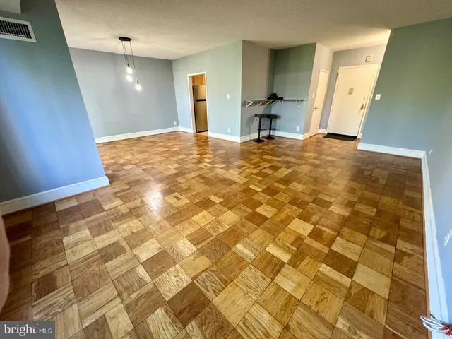 a view of a park with bench and trees