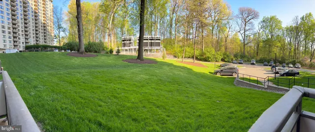 a view of a patio with a table and chairs under an umbrella