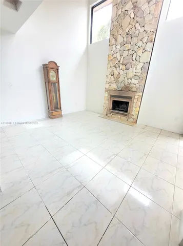 a kitchen with a sink and a refrigerator