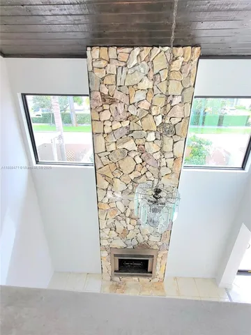 a kitchen with stainless steel appliances a refrigerator sink and microwave