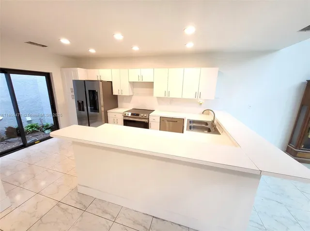 a view of a room with a large window